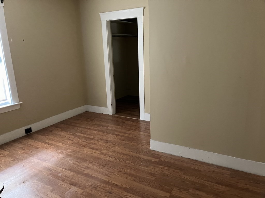 328 Worcester Street Southbridge, MA 01550 - Photo 12 of 26 an empty room with wooden floor and closet