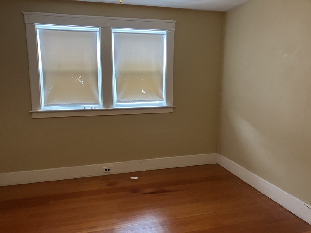 328 Worcester Street Southbridge, MA 01550 - Photo 17 of 26 a view of a small space with wooden floor and a window
