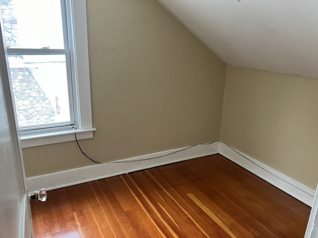 328 Worcester Street Southbridge, MA 01550 - Photo 19 of 26 a view of a room with wooden floor and windows