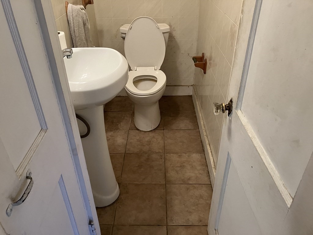 328 Worcester Street Southbridge, MA 01550 - Photo 9 of 26 a bathroom with a toilet and a shower