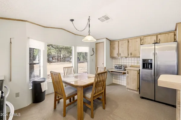 a kitchen with stainless steel appliances kitchen island granite countertop a sink and cabinets