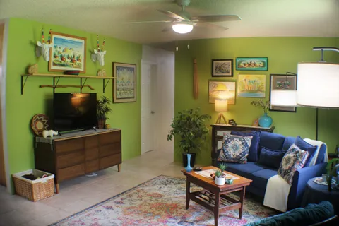 a living room with furniture and a flat screen tv