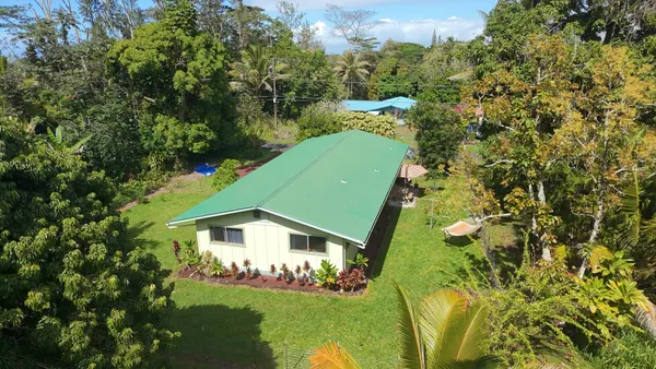 a view of a back yard of a house
