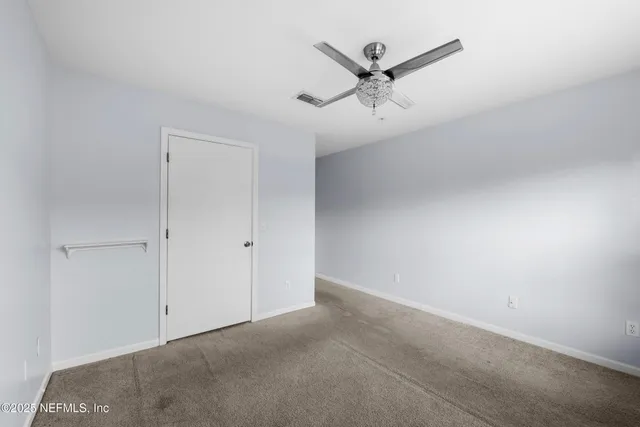 a view of a ceiling fan in a room