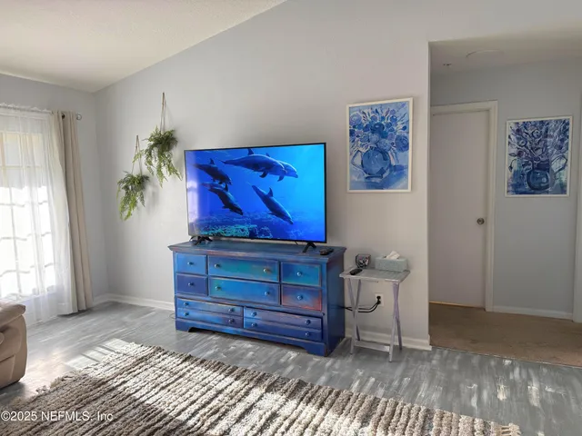 a room with a bench and a rug