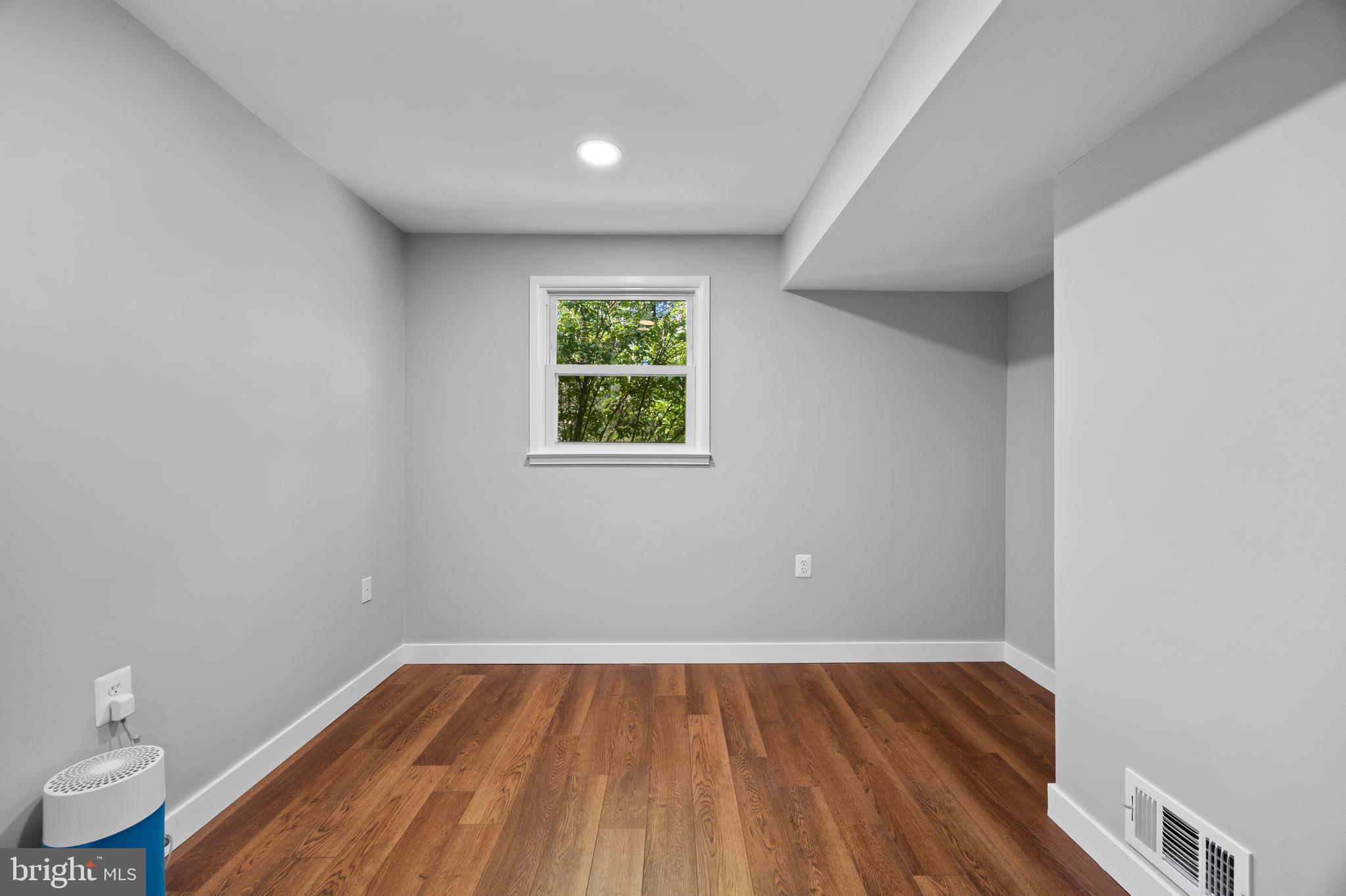 11019 Ring Road Reston, VA 20190 - Photo 55 of 78 a view of empty room with wooden floor and fan