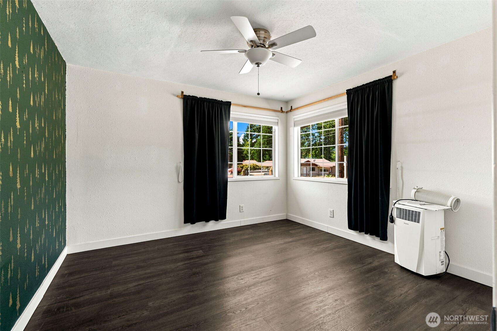 158 Gharet Road Randle, WA 98377 - Photo 15 of 25 a view of an empty room with a window and wooden floor
