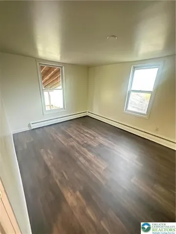 a bathroom with a toilet a sink and shower
