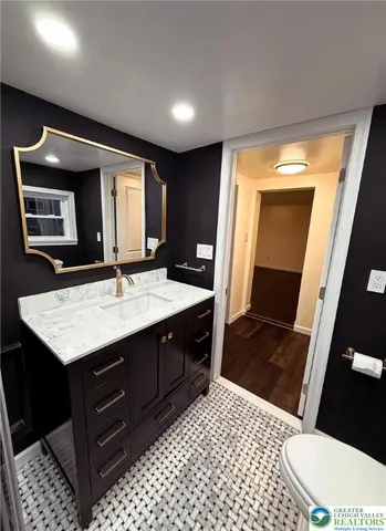 a view of a house with a yard and a garden