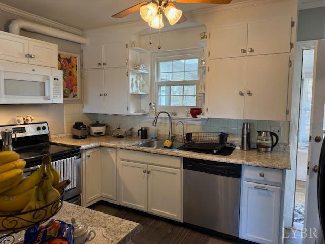 153 Ridge Street Madison Heights, VA 24572 - Photo 14 of 26 a kitchen with a sink dishwasher a stove and white cabinets