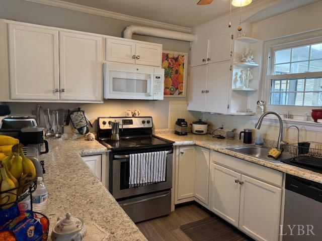 153 Ridge Street Madison Heights, VA 24572 - Photo 18 of 26 a kitchen with stainless steel appliances granite countertop a sink stove and cabinets
