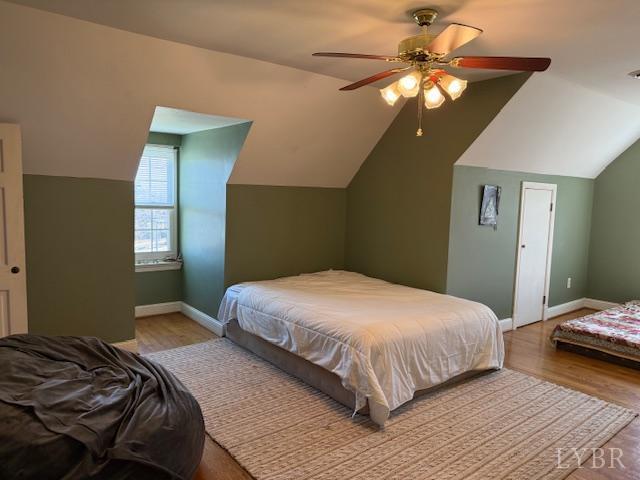 153 Ridge Street Madison Heights, VA 24572 - Photo 19 of 26 a bedroom with a bed and a chandelier