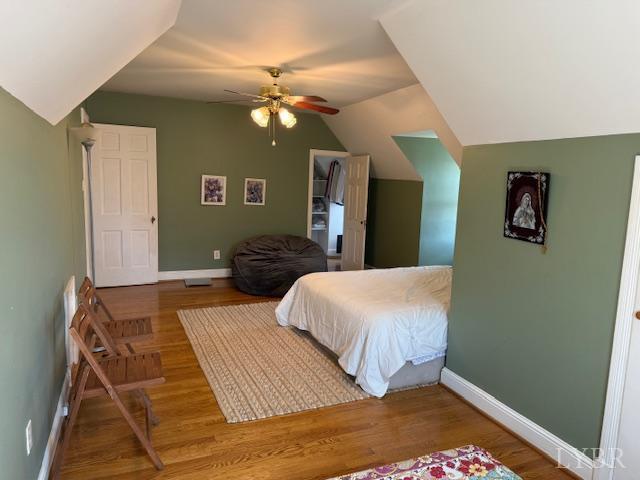 153 Ridge Street Madison Heights, VA 24572 - Photo 20 of 26 a bedroom with a bed and wooden floor