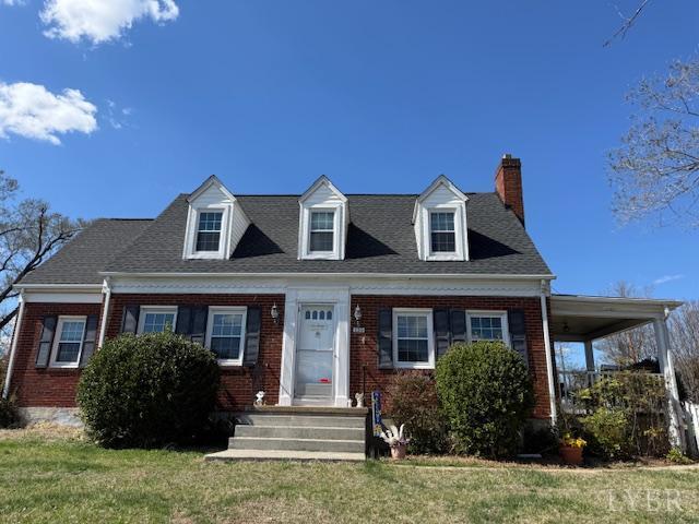 153 Ridge Street Madison Heights, VA 24572 - Photo 2 of 26 a front view of a house with a garden