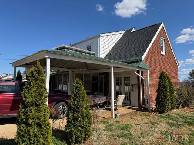 153 Ridge Street Madison Heights, VA 24572 - Photo 24 of 26 a view of a house with patio outdoor seating