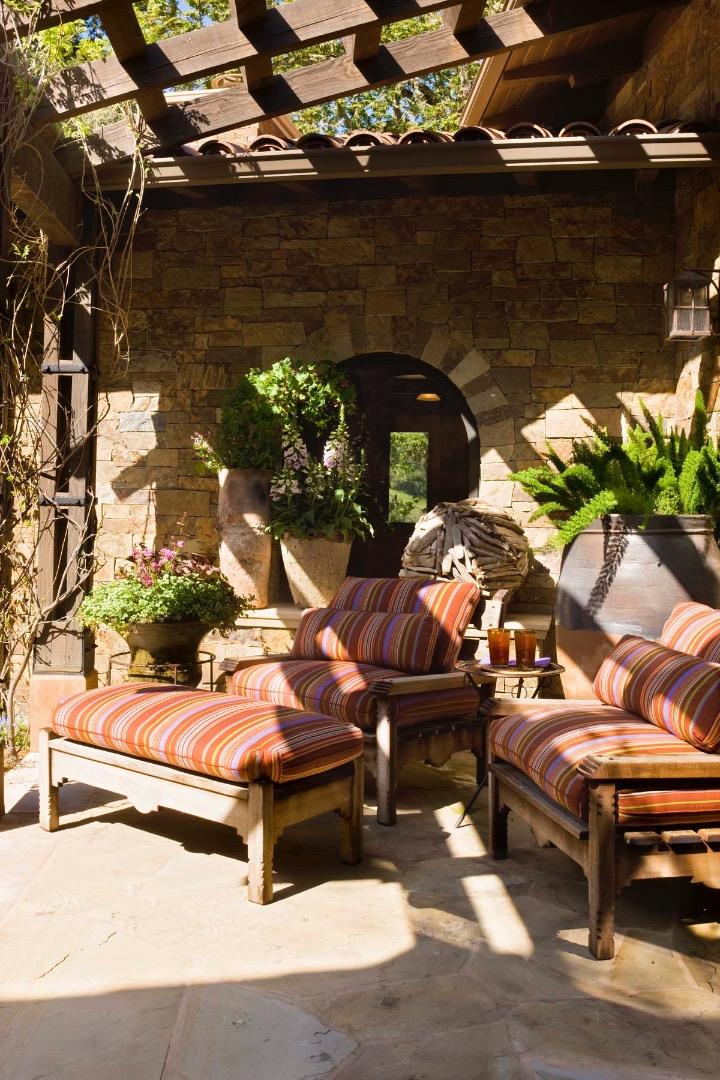 4 Rumsen Trace Carmel, CA 93923 - Photo 15 of 15 a backyard of a house with table and chairs