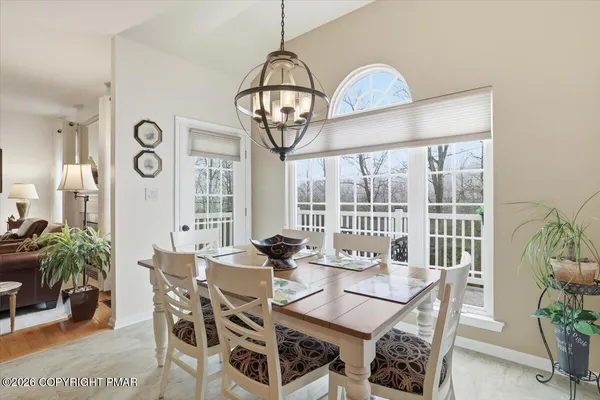 a view of a dining room with furniture