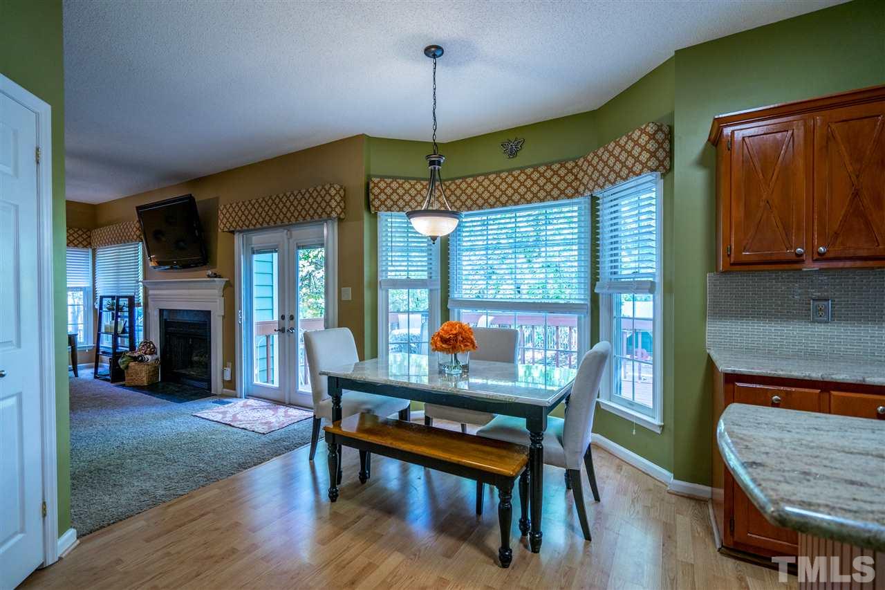 11912 Fairlie Place Raleigh, NC 27613 - Photo 14 of 25 a dining room with furniture and window