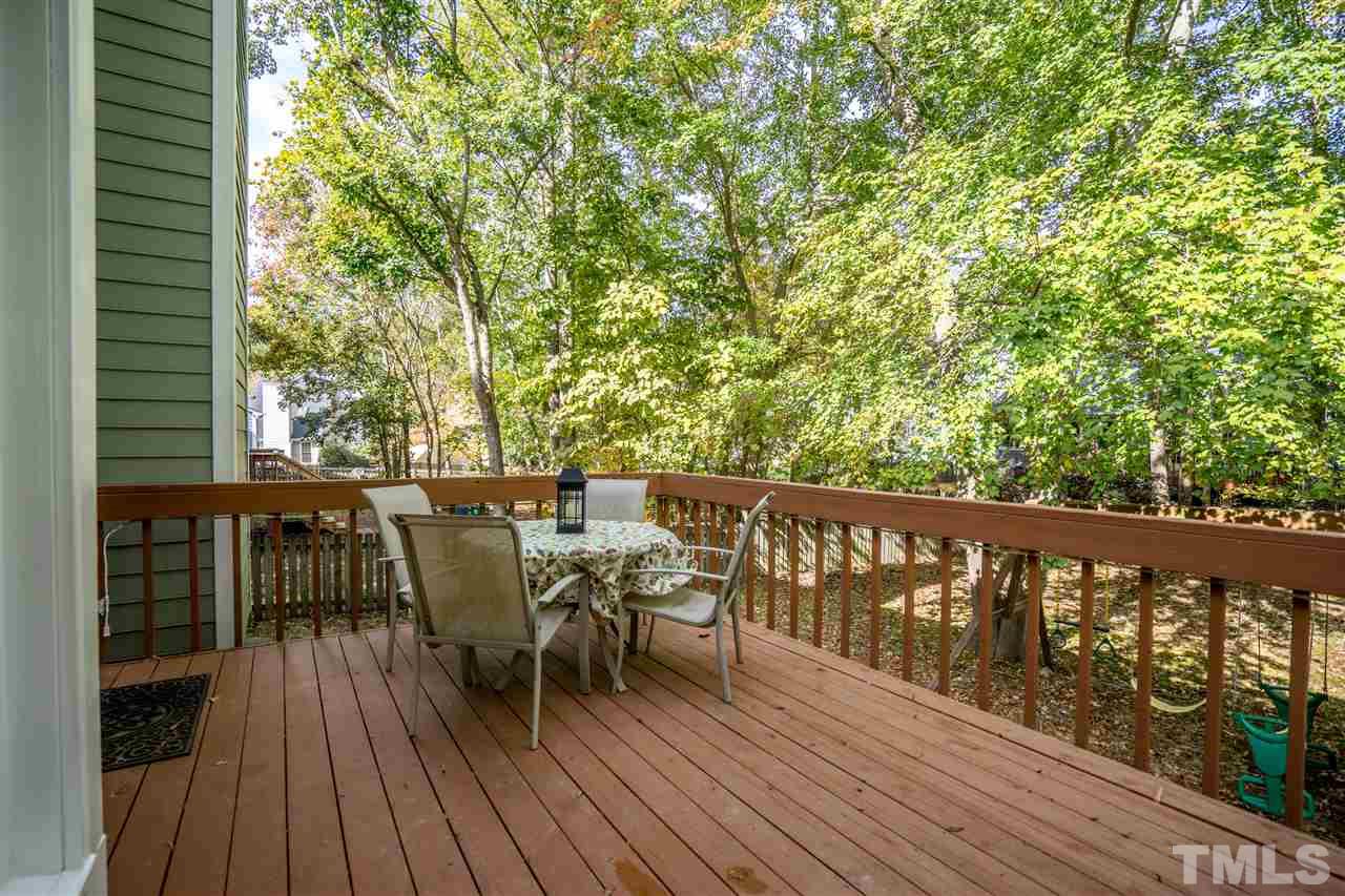 11912 Fairlie Place Raleigh, NC 27613 - Photo 24 of 25 a view of a balcony with furniture and wooden floor