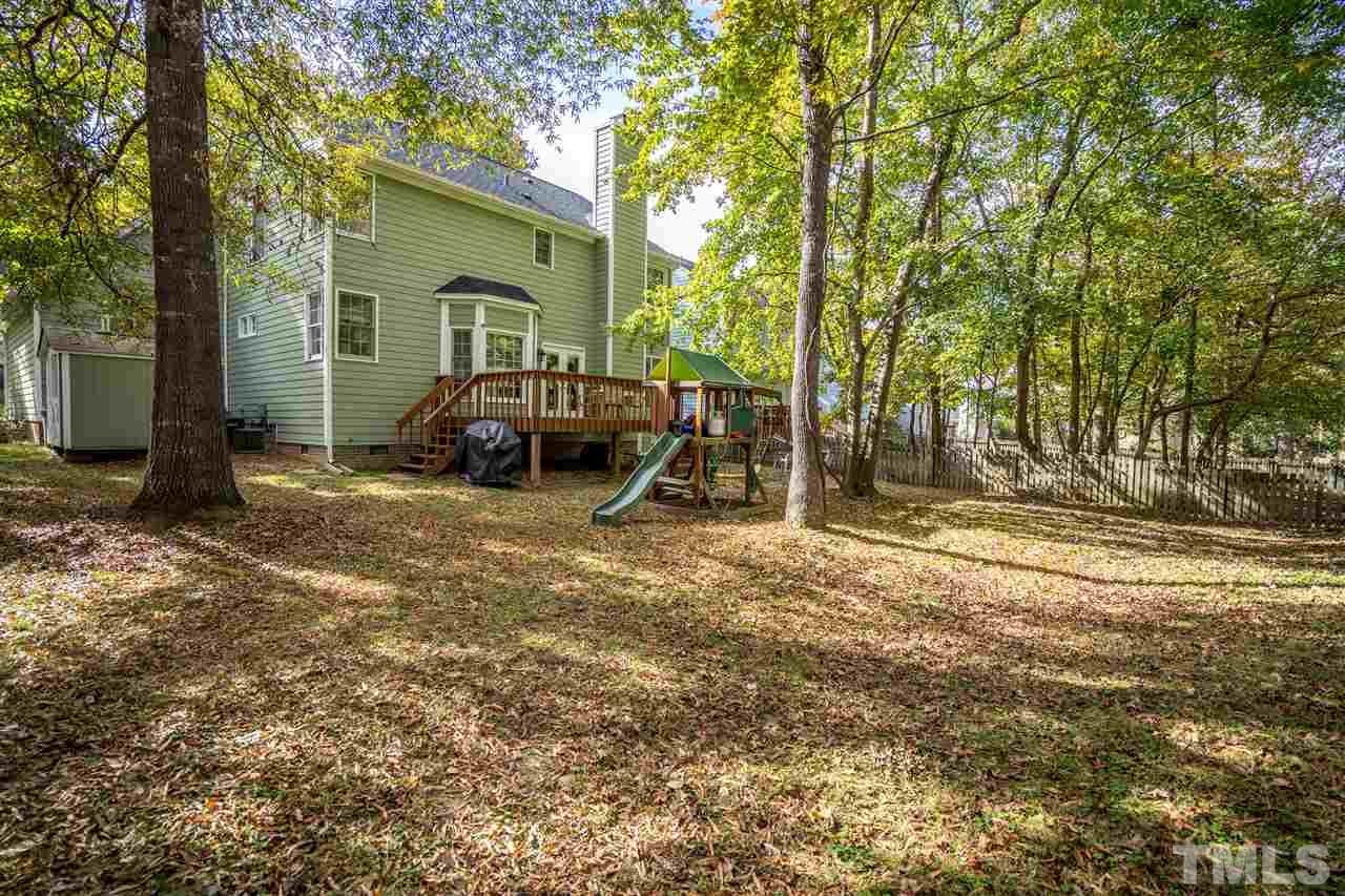 11912 Fairlie Place Raleigh, NC 27613 - Photo 25 of 25 a front view of a house with a yard