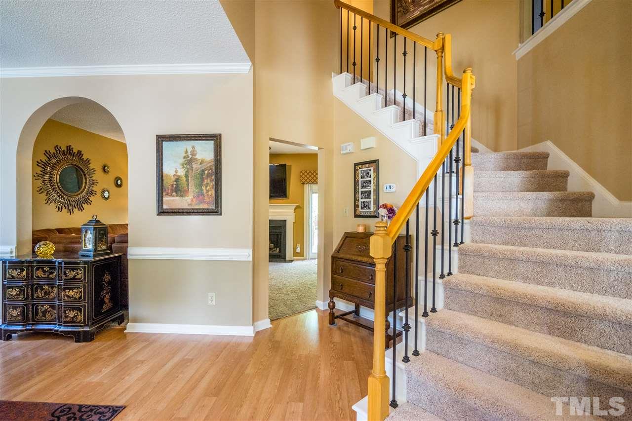 11912 Fairlie Place Raleigh, NC 27613 - Photo 4 of 25 a view of entryway and hall with wooden floor