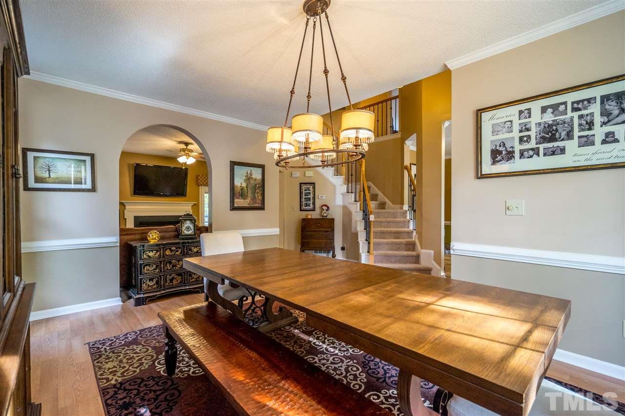 11912 Fairlie Place Raleigh, NC 27613 - Photo 7 of 25 a living room with pool table and a flat screen tv