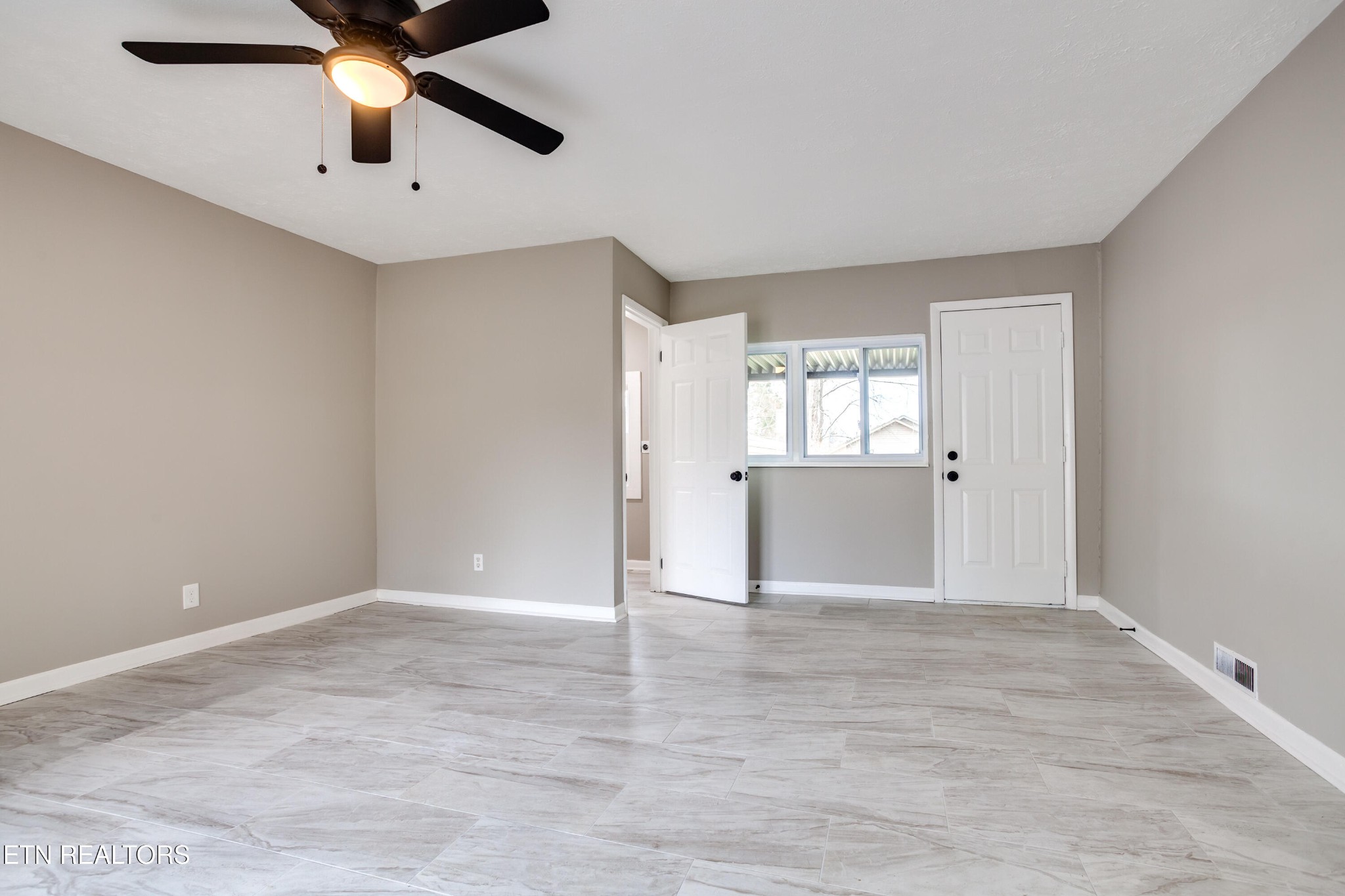 5715 Brown Gap Road Knoxville, TN 37918 - Photo 14 of 37 wooden floor in an empty room with a window