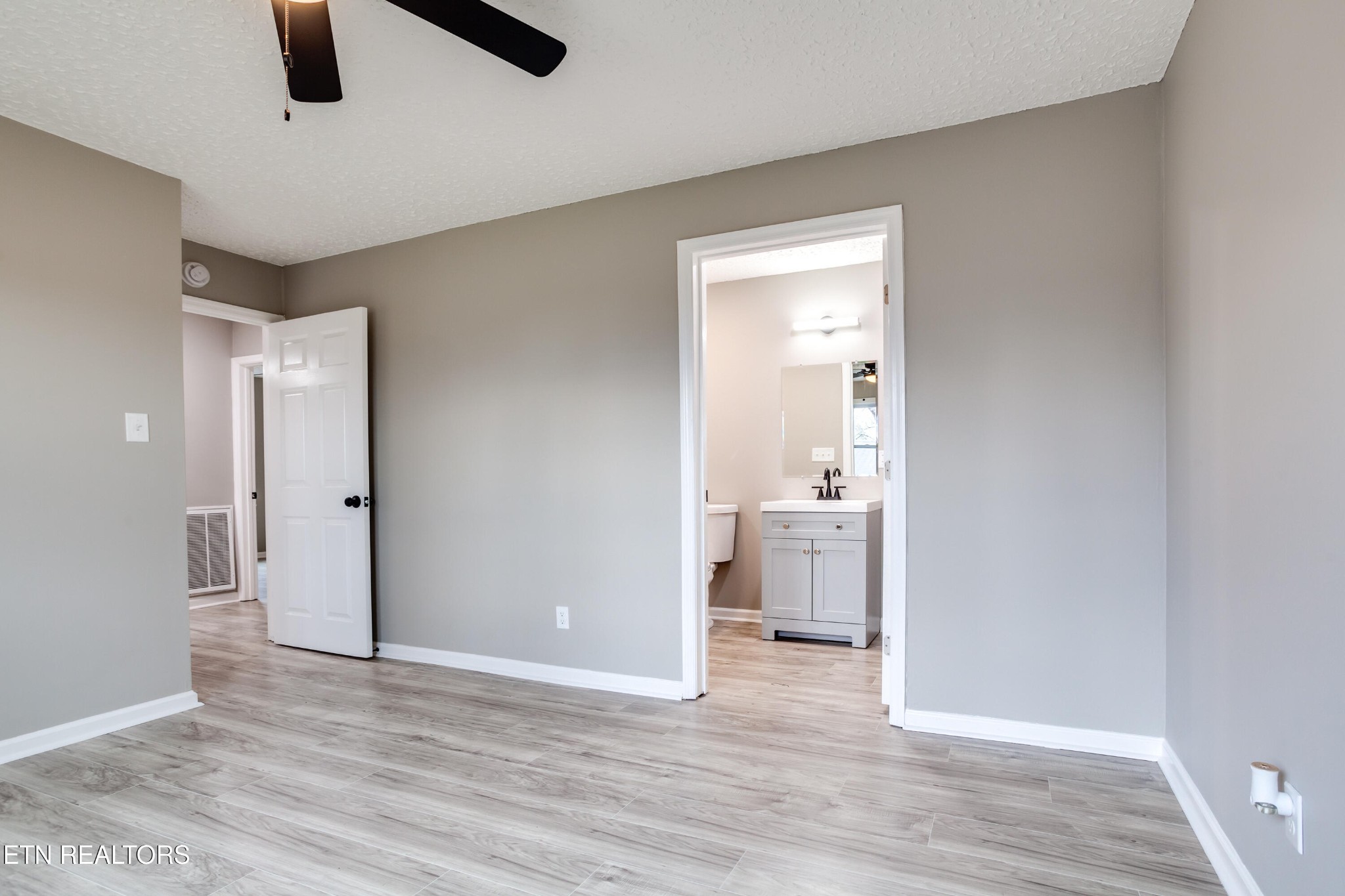 5715 Brown Gap Road Knoxville, TN 37918 - Photo 20 of 37 wooden floor in an empty room and a bathroom
