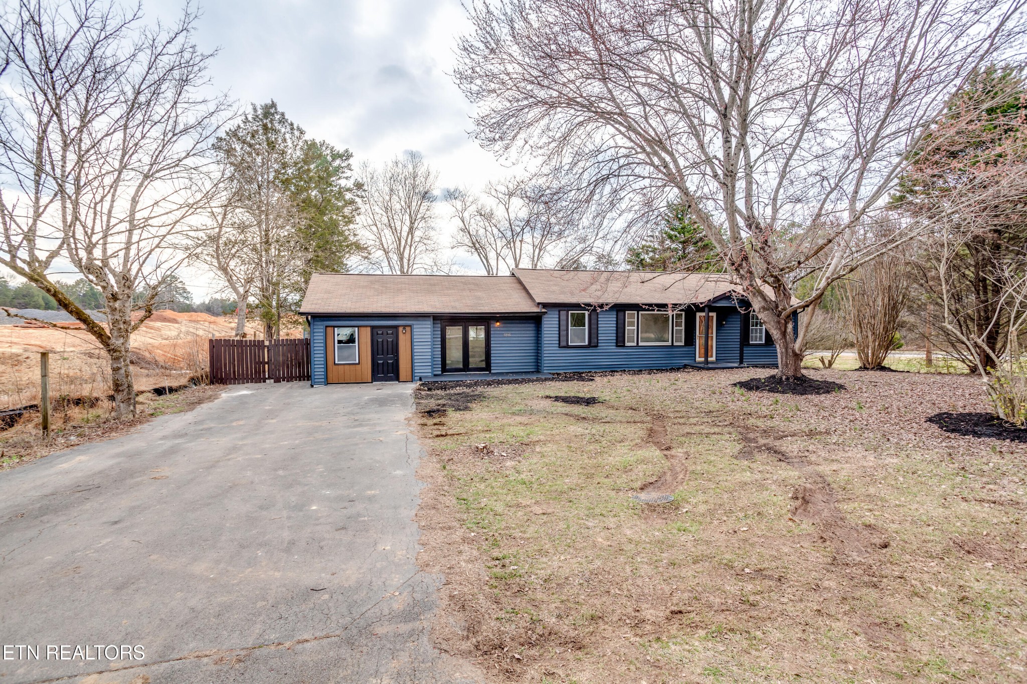 5715 Brown Gap Road Knoxville, TN 37918 - Photo 2 of 37 a front view of a house with a yard covered with snow