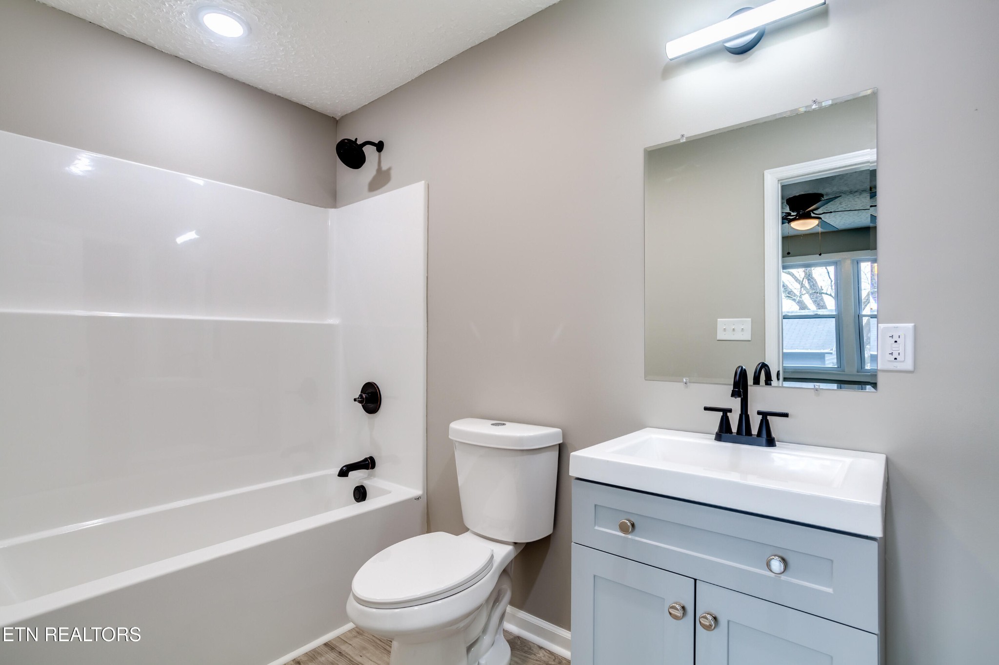 5715 Brown Gap Road Knoxville, TN 37918 - Photo 22 of 37 a bathroom with a sink a toilet and shower