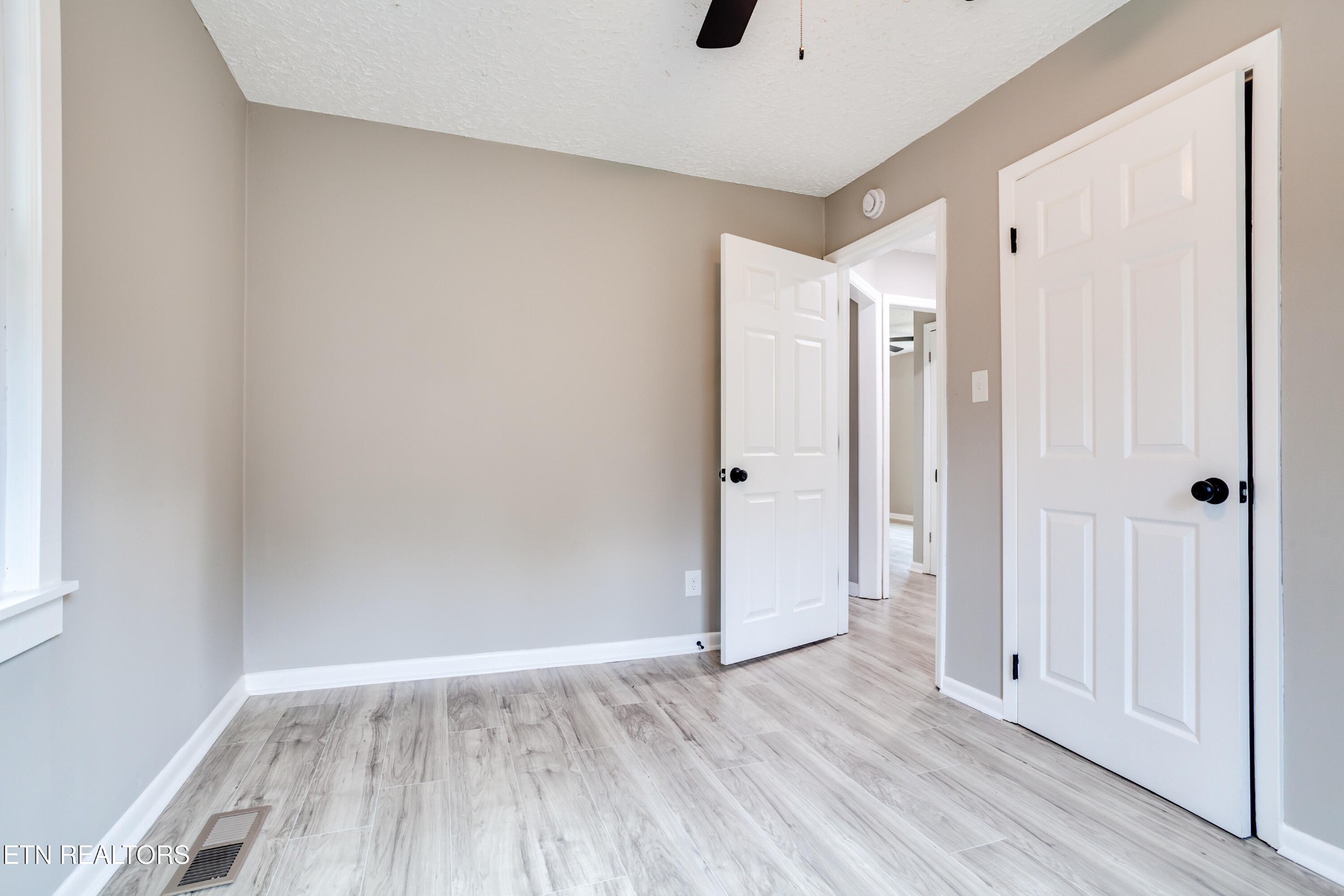 5715 Brown Gap Road Knoxville, TN 37918 - Photo 29 of 37 a view of an empty room and wooden floor