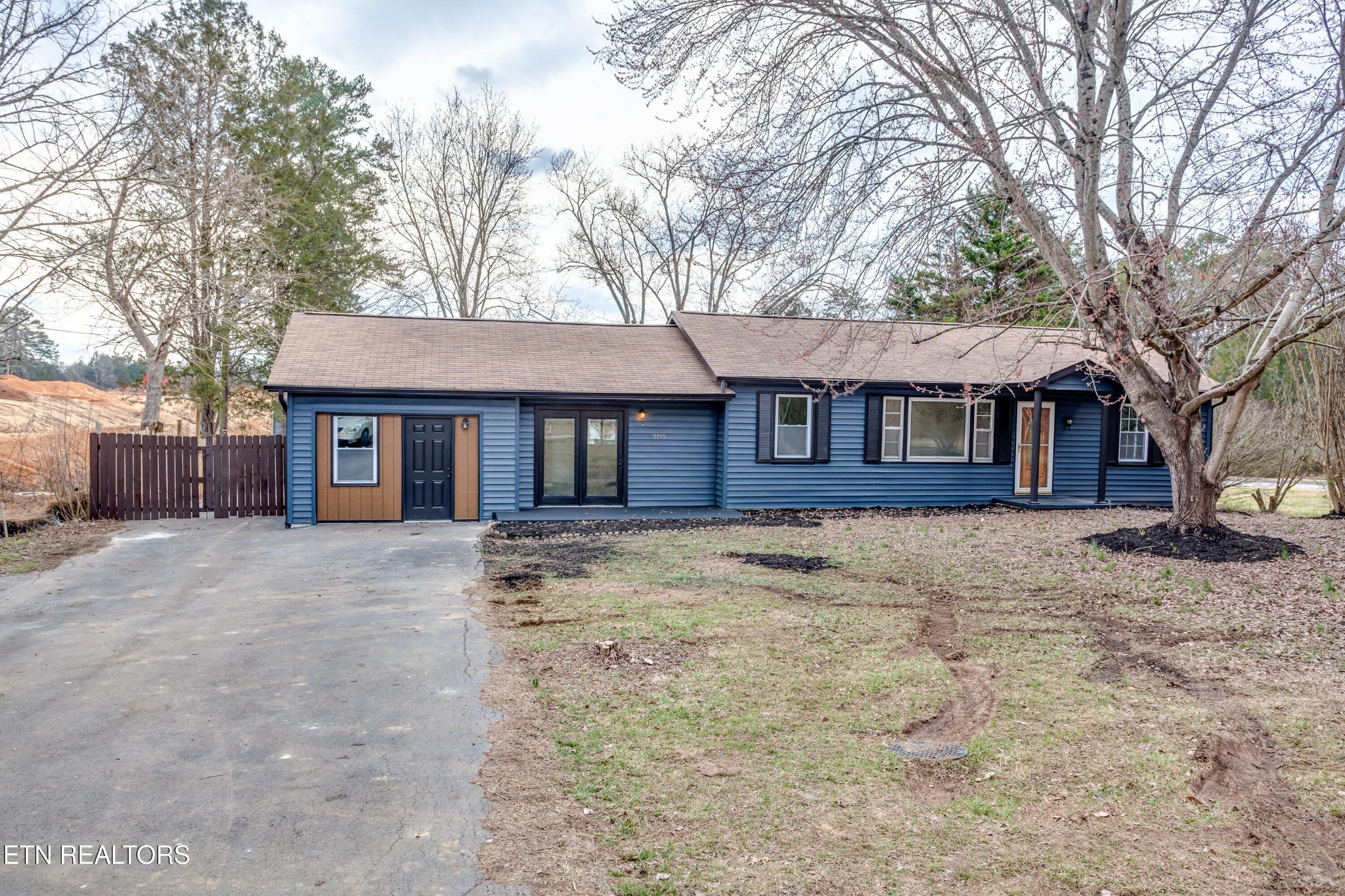 5715 Brown Gap Road Knoxville, TN 37918 - Photo 3 of 37 a front view of a house with a yard and garage