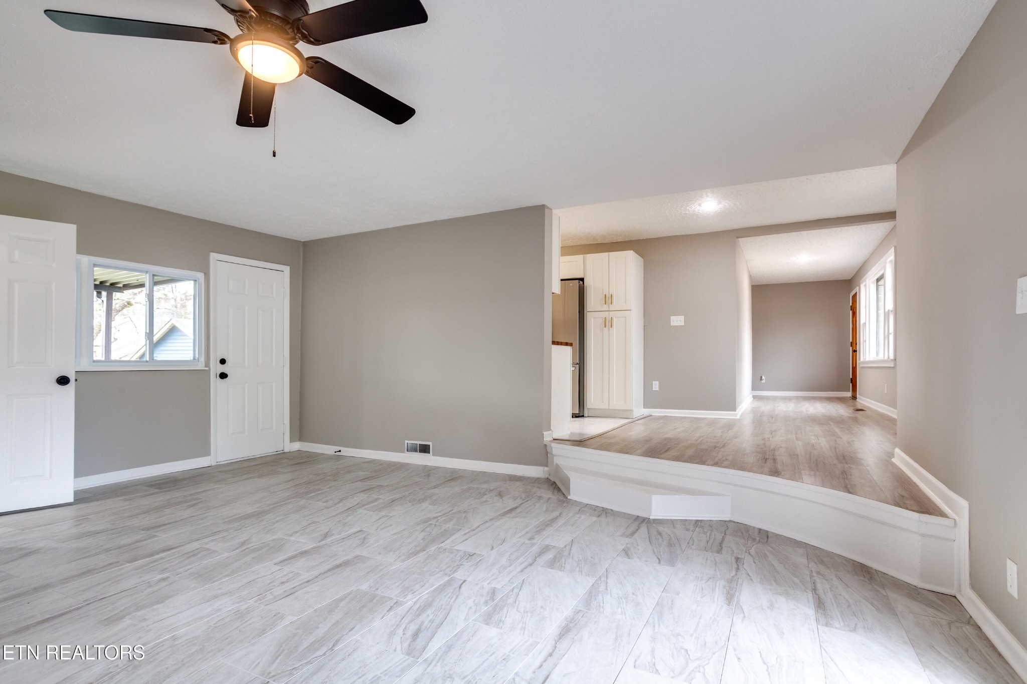 5715 Brown Gap Road Knoxville, TN 37918 - Photo 9 of 37 a view of an empty room and window with a chandelier fan