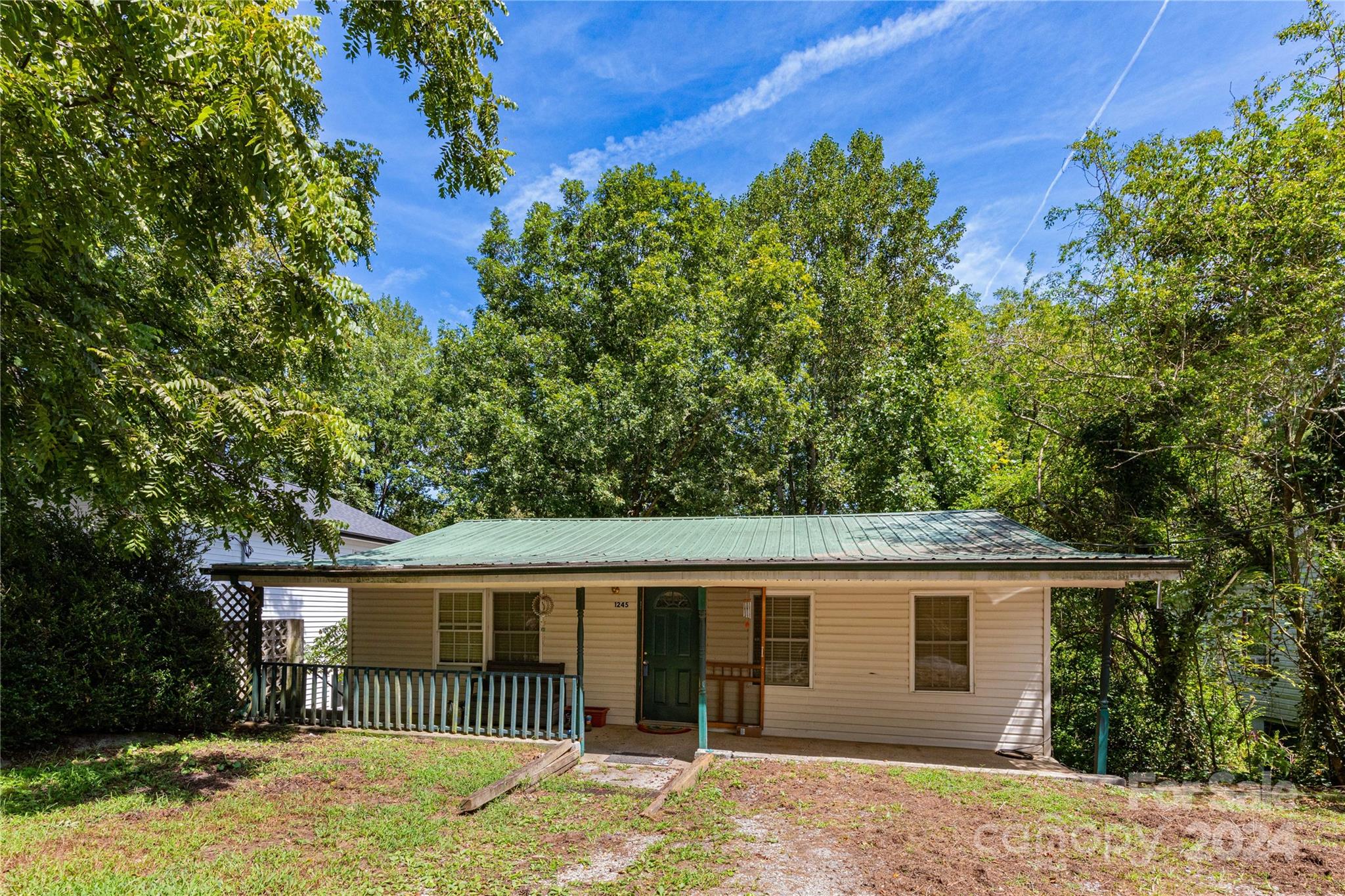 1245 Pine Spring Drive Hendersonville, NC 28739 - Photo 1 of 20 front view of a house with a yard
