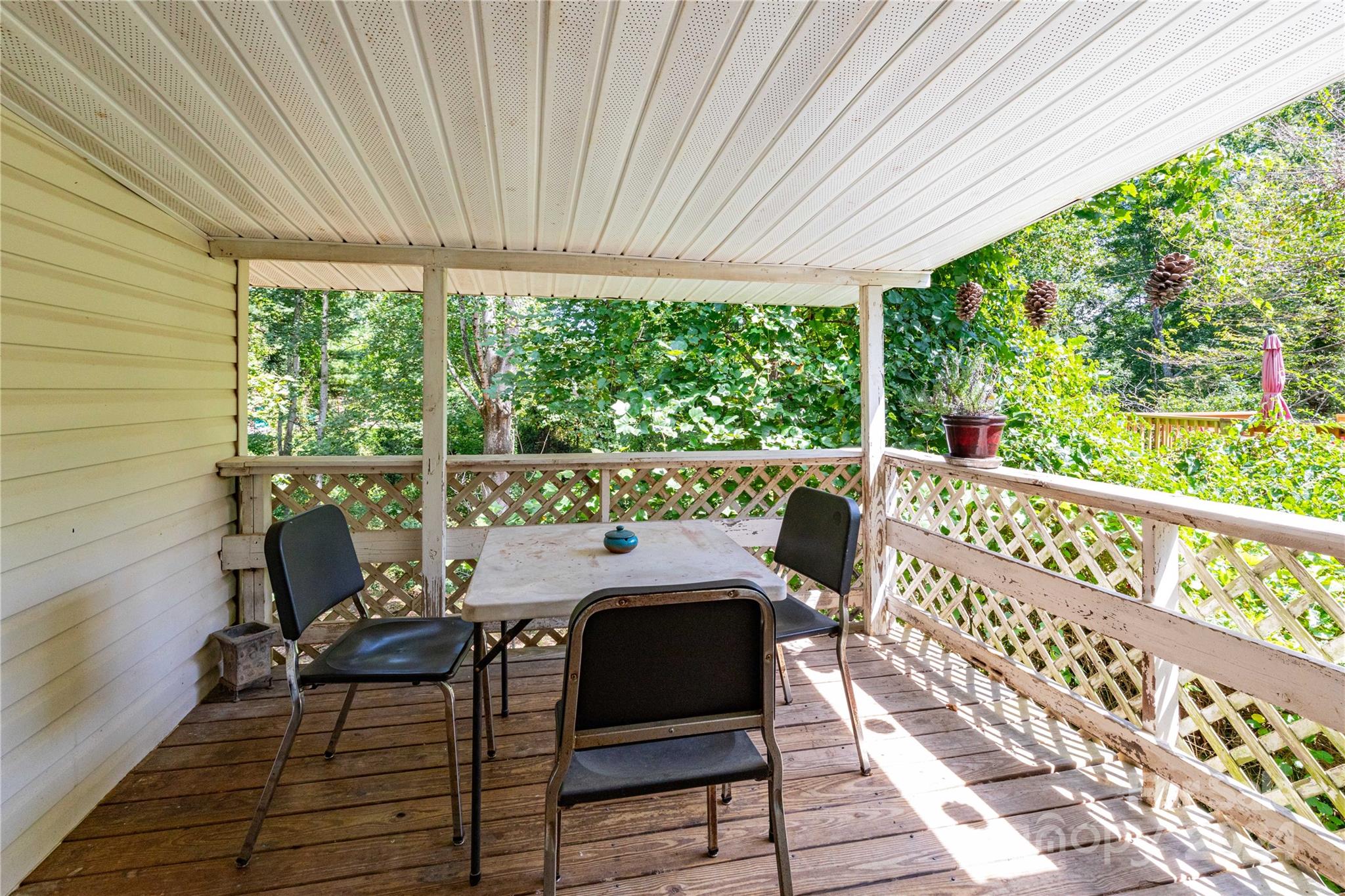 1245 Pine Spring Drive Hendersonville, NC 28739 - Photo 11 of 20 a view of a chair and table in the balcony