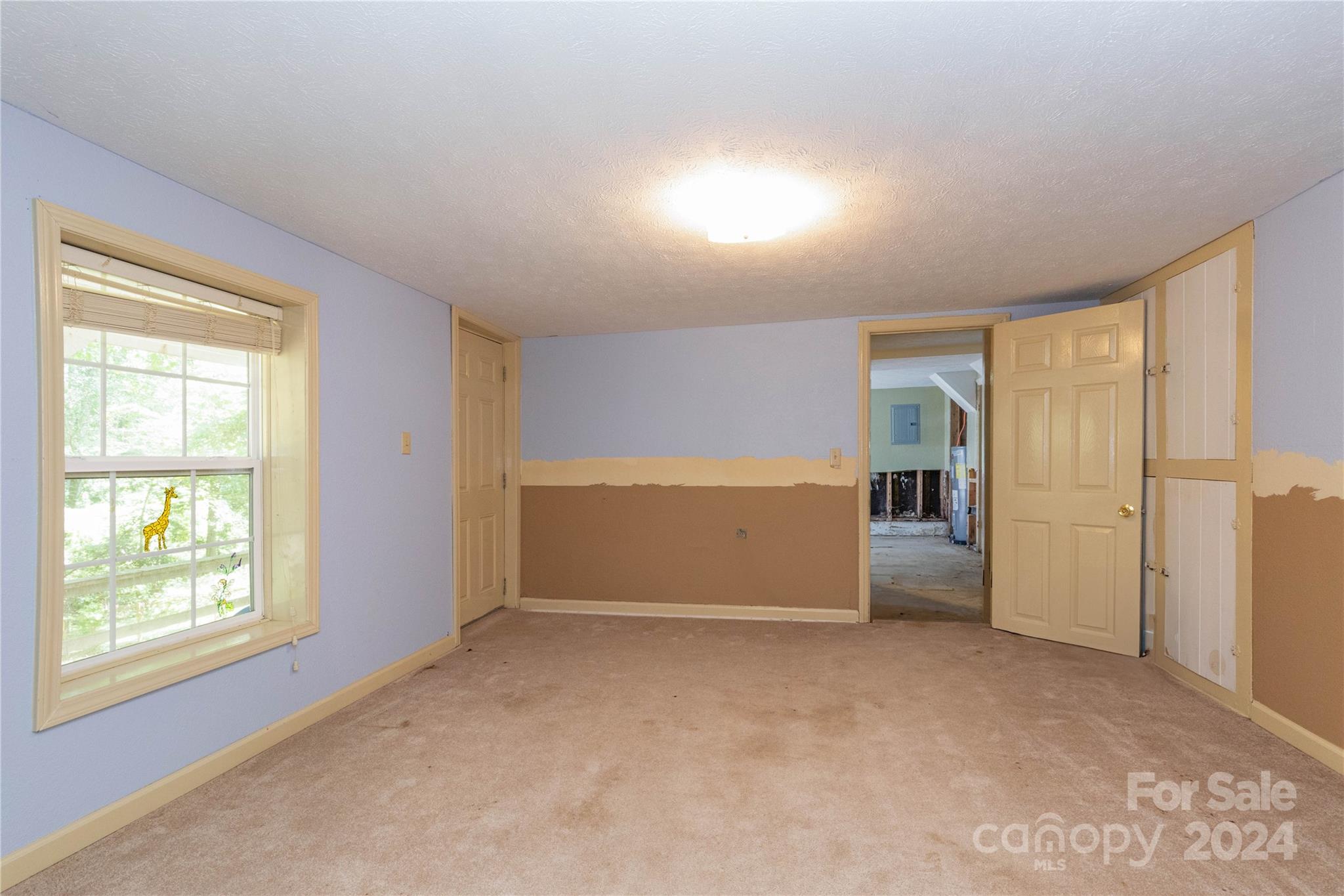 1245 Pine Spring Drive Hendersonville, NC 28739 - Photo 16 of 20 a view of an empty room and window