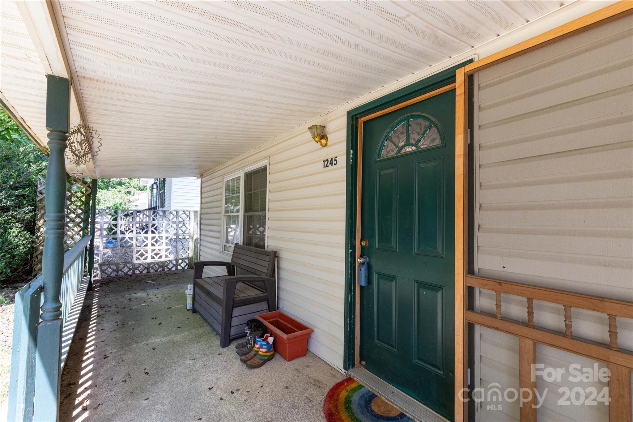 1245 Pine Spring Drive Hendersonville, NC 28739 - Photo 3 of 20 a view of a porch with furniture