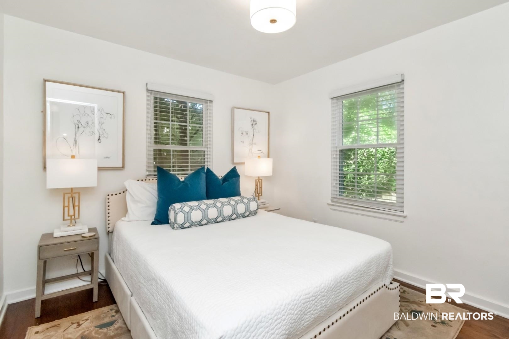 18 Princess Anne Road Mobile, AL 36608 - Photo 25 of 41 Bedroom with dark wood-type flooring and multiple windows