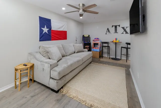 a living room with furniture and a flat screen tv