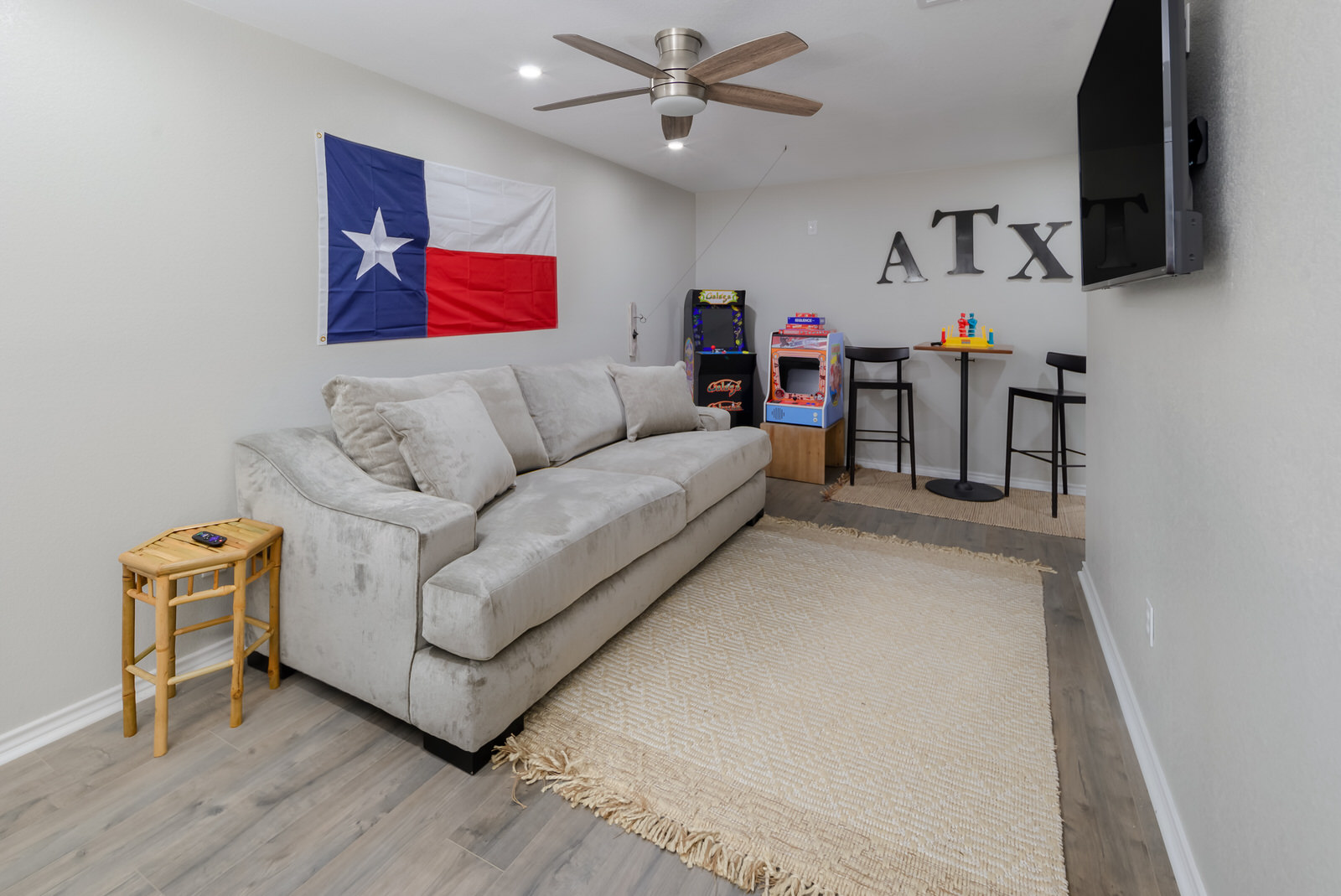 1651 Chippeway Lane Austin, TX 78745 - Photo 11 of 26 a living room with furniture and a flat screen tv