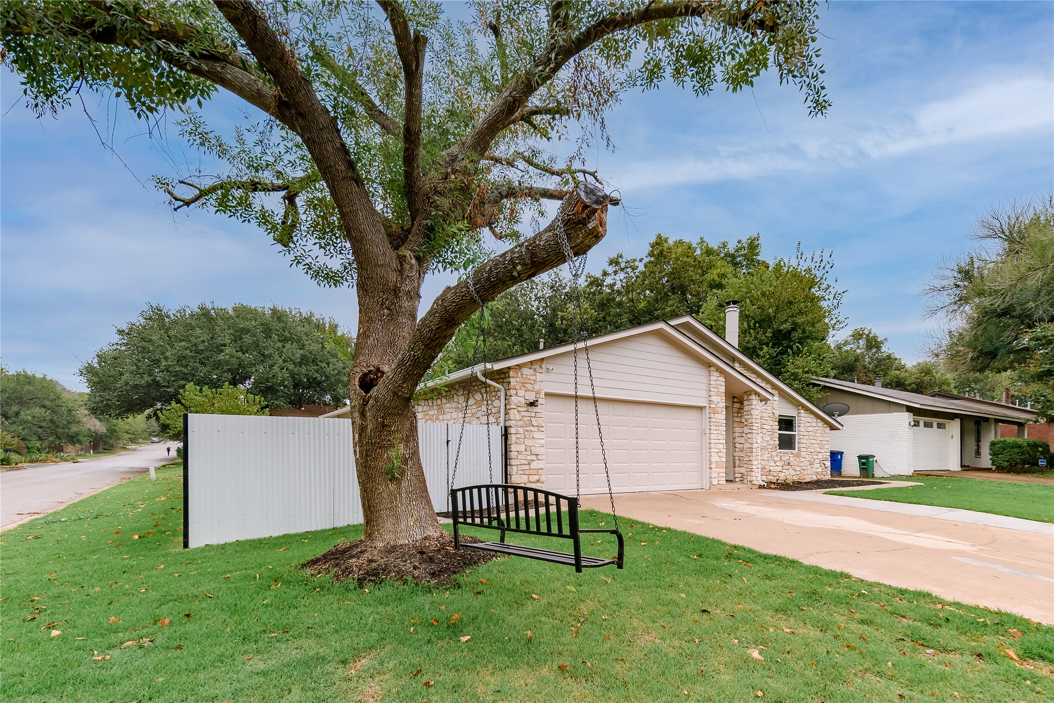 1651 Chippeway Lane Austin, TX 78745 - Photo 23 of 26 a white house that has a tree in front of it