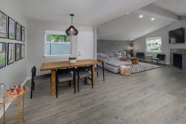 a view of a dining room with furniture window and wooden floor