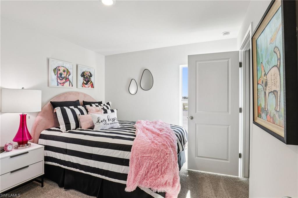 8040 Cedar Ky Way Lehigh Acres, FL 33971 - Photo 18 of 27 Model home. View of carpeted bedroom