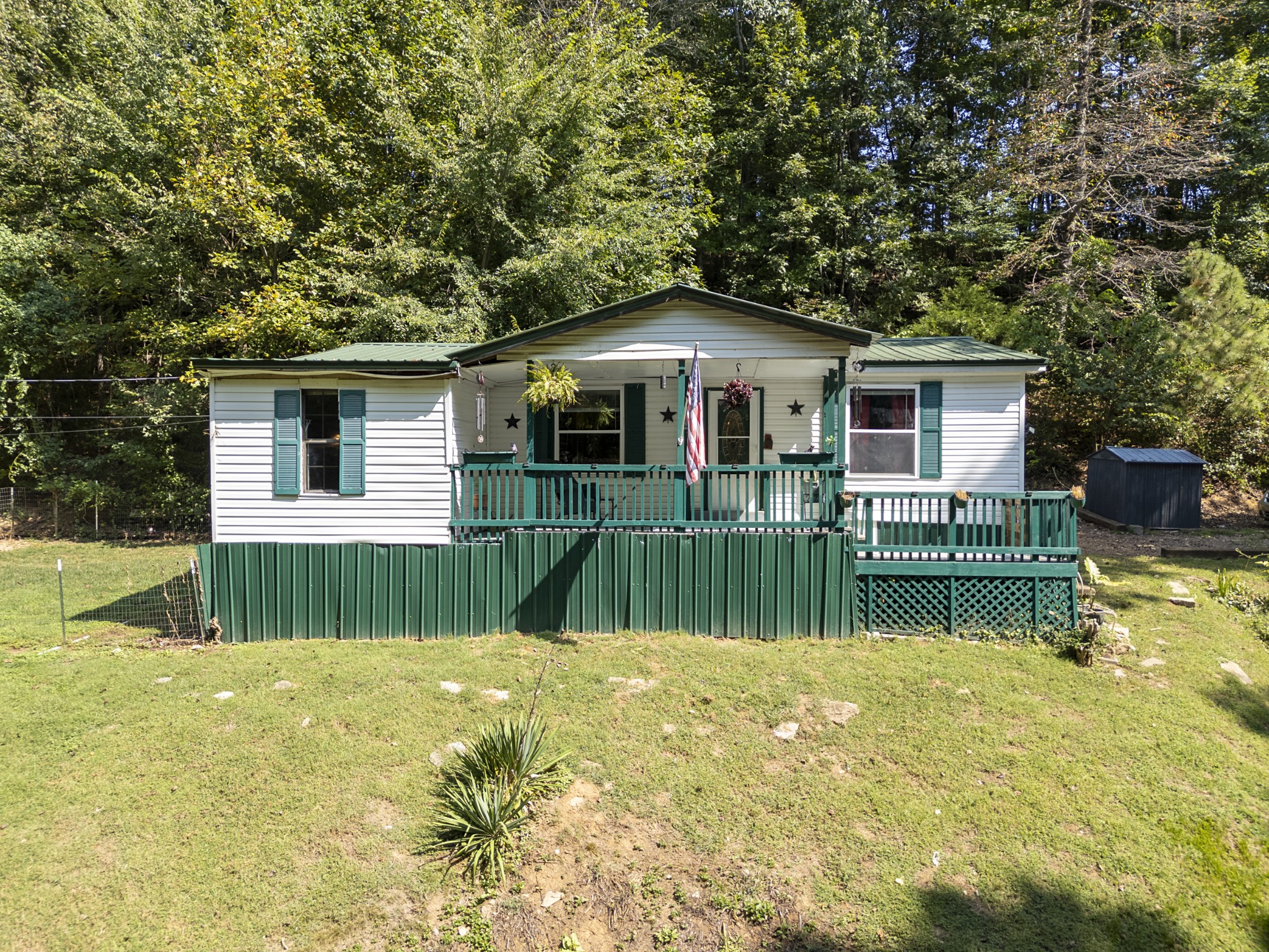 a front view of a house with a yard table and chairs