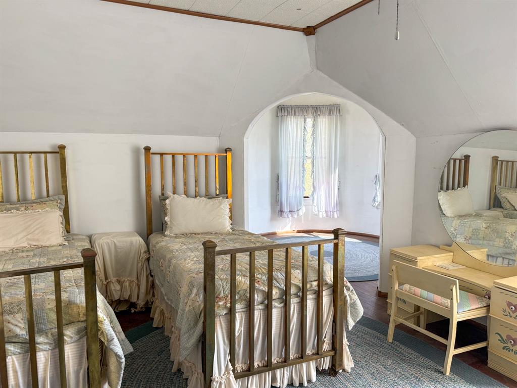641 West 2nd Street Baird, TX 79504 - Photo 13 of 15 a bedroom with furniture and wooden floor