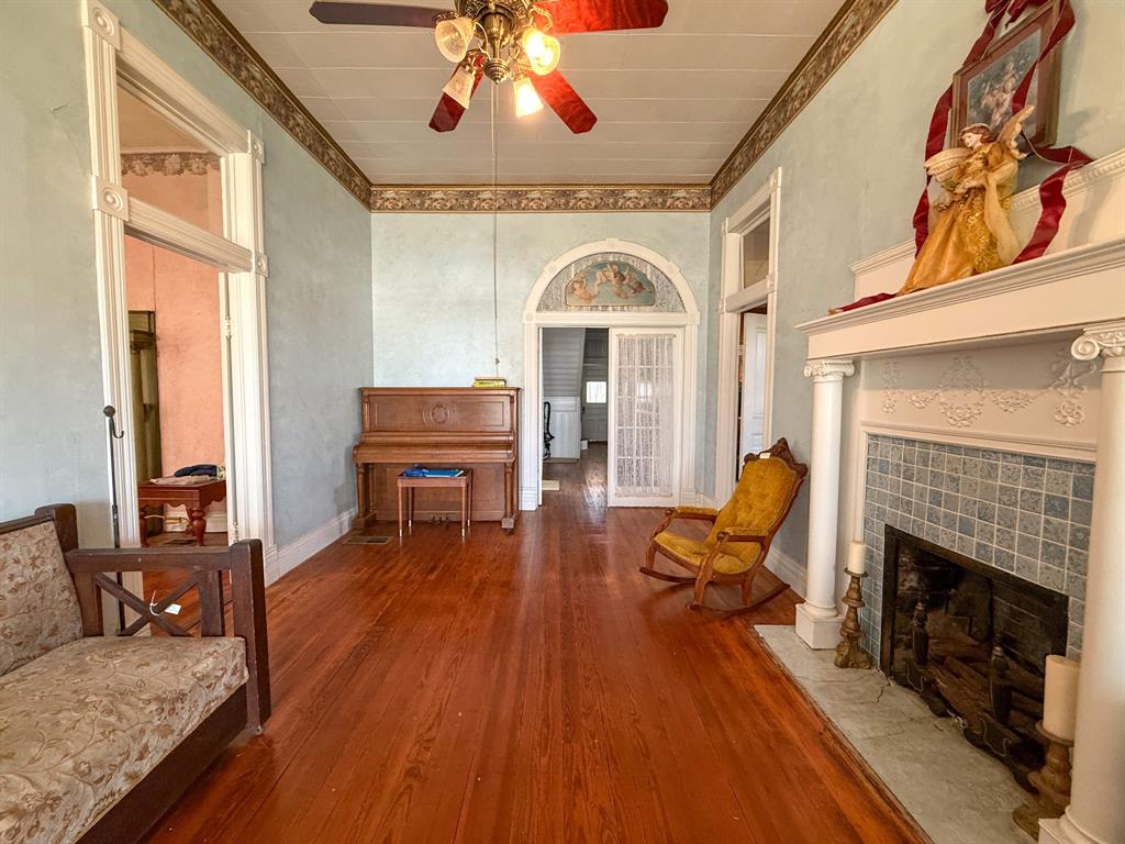 641 West 2nd Street Baird, TX 79504 - Photo 3 of 15 a living room with furniture and a fireplace