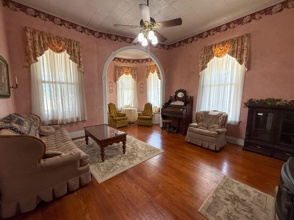 641 West 2nd Street Baird, TX 79504 - Photo 8 of 15 a living room with furniture and a large window