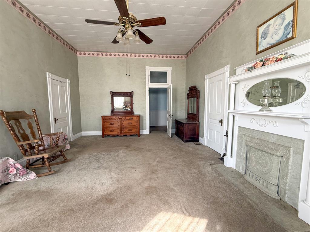 641 West 2nd Street Baird, TX 79504 - Photo 9 of 15 a living room with furniture and a fireplace