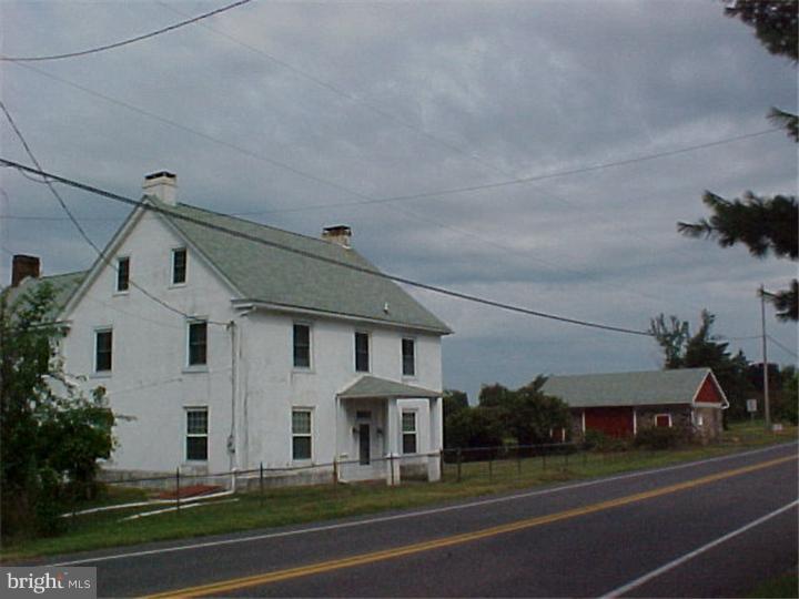 2616 Big Road Gilbertsville, PA 19525 - Photo 14 of 14 a view of a big house in a big yard with plants and large trees