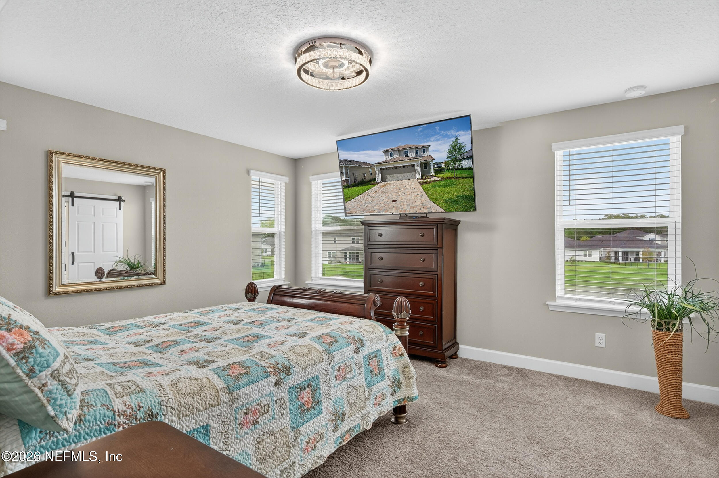 57 Cedar Elm Way St. Augustine, FL 32092 - Photo 20 of 65 a bedroom with a bed and a fireplace